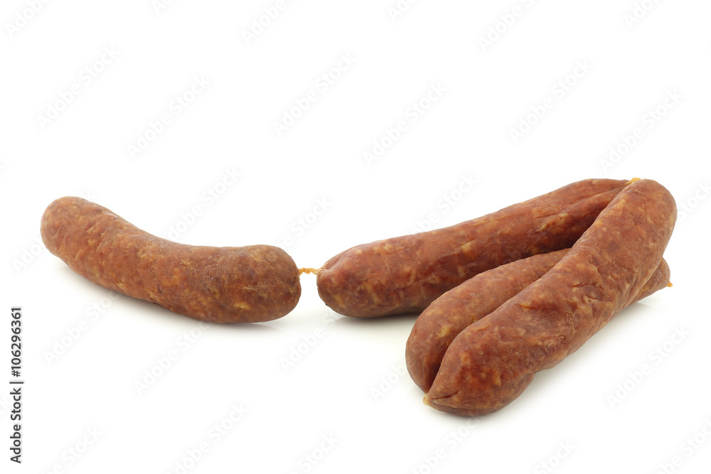 traditional Dutch smoked and dried sausages on a white background
traditional Dutch smoked and dried sausages on a white background