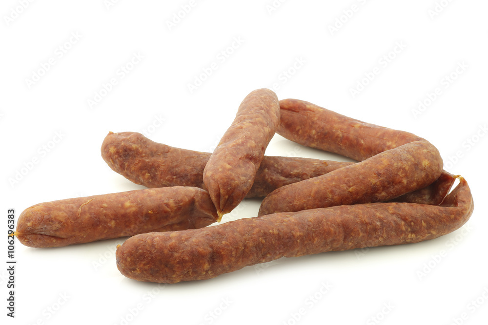 traditional Dutch smoked and dried sausages on a white background
traditional Dutch smoked and dried sausages on a white background