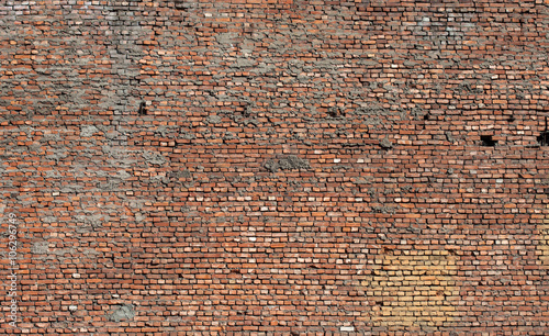 texture of old grunge dirty brick wall with peeling plaster