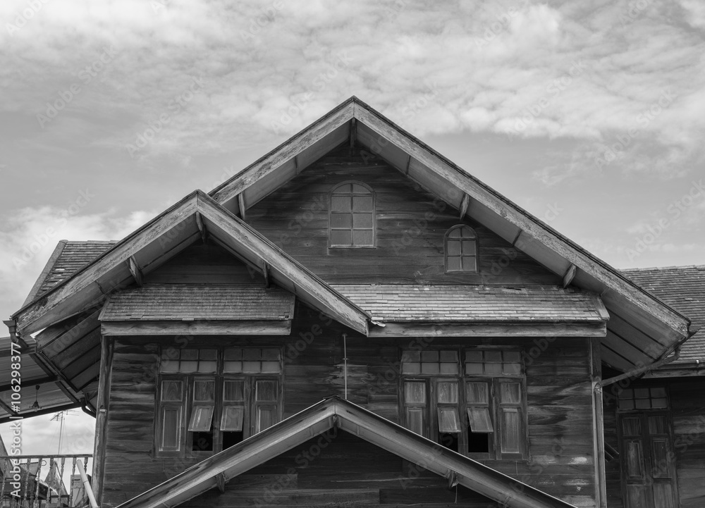 Old wooden house in black and white photo. Old wooden house in black and white photo.