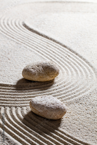 Canvas Print zen sand still-life - two stones showing different directions for concept of evo