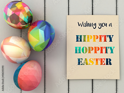 Wishing you hippity hoppity  Easter greeting card and Colorful Easter eggs  on white wooden background. Easter greeting card design. photo