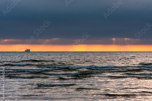 Sunset the ship on the horizon.