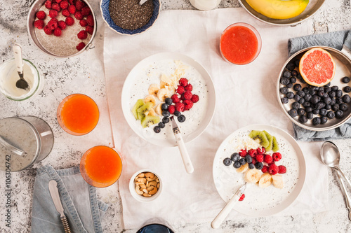 Ideal acai coconut yogurt bowl with berries and fruity smoothies. Detox and healthy Breakfast concept. Top view.  photo