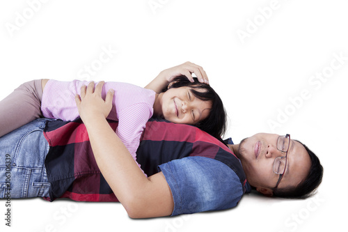 Father and his girls lying in the studio