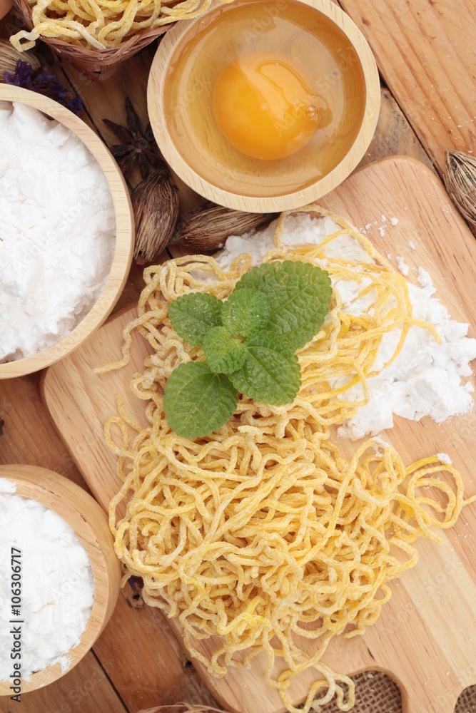 Making noodle with wheat flour and egg for cooking. Making noodle with wheat flour and egg for cooking.