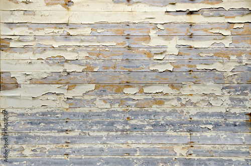 Peeling paint on an old wooden wall. Background.