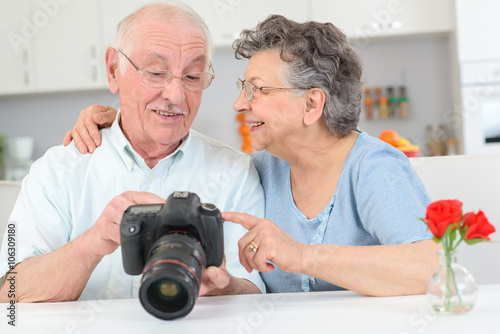 elderly couple with high powered camera
