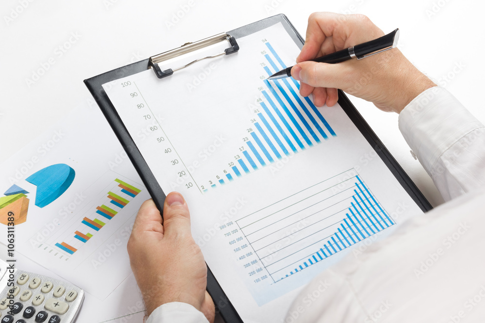 Businessman counting losses and profit working with statistics, analyzing financial the results on white background. Copy space Businessman counting losses and profit working with statistics, analyzing financial the results on white background. Copy space