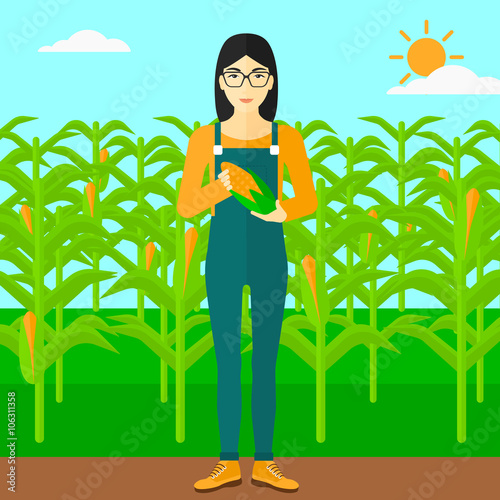 Farmer holding corn.