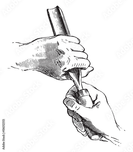 Both hands holding the gouge, vintage engraving.