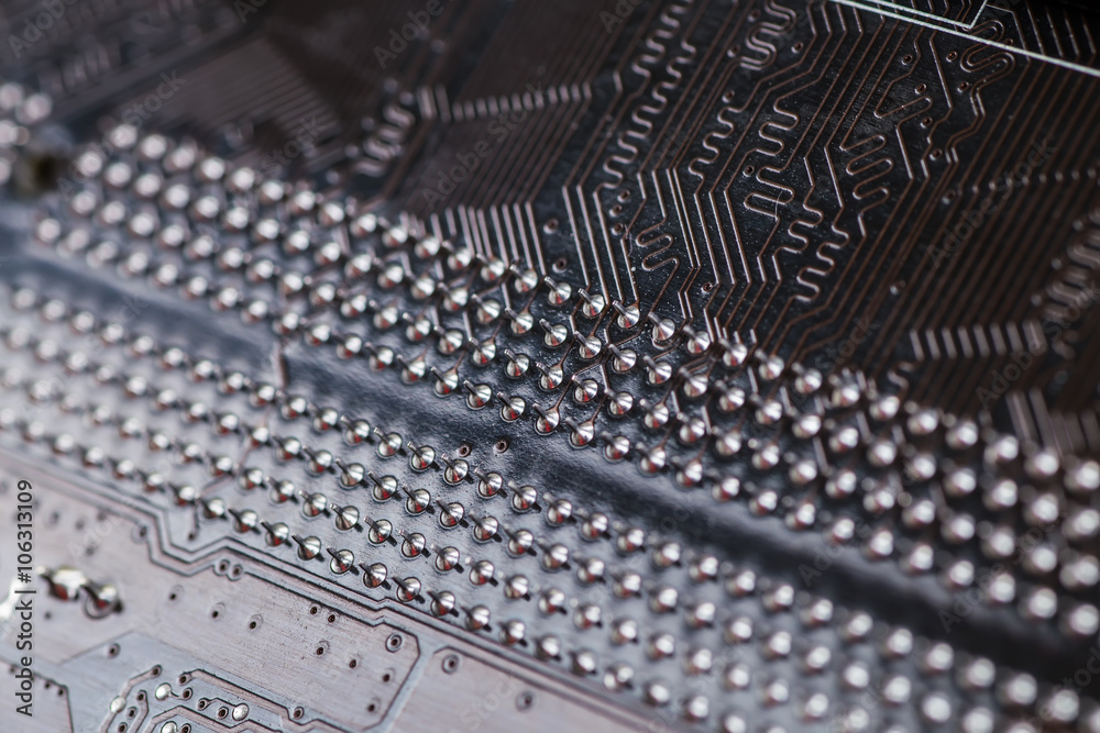 Macro closeup of a computer PCB Motherboard using brown and blac Macro closeup of a computer PCB Motherboard using brown and blac