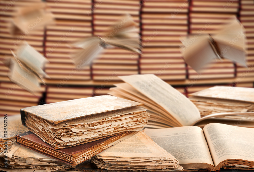 Obraz premium Pile of open books in library