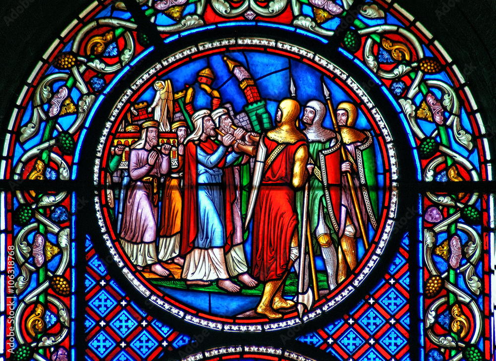 Stained glass window depicting the fall of the walls of Jericho