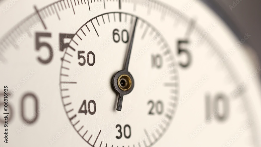Stopwatch time lapse. A stop watch clockwork clock face timelapse with selective focus and limited depth of field. Stopwatch time lapse. A stop watch clockwork clock face timelapse with selective focus and limited depth of field.