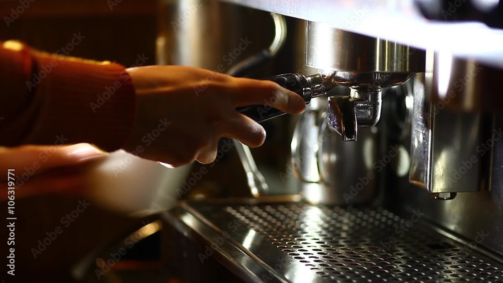 Detail of an espresso making machine and a cup. Detail of an espresso making machine and a cup.