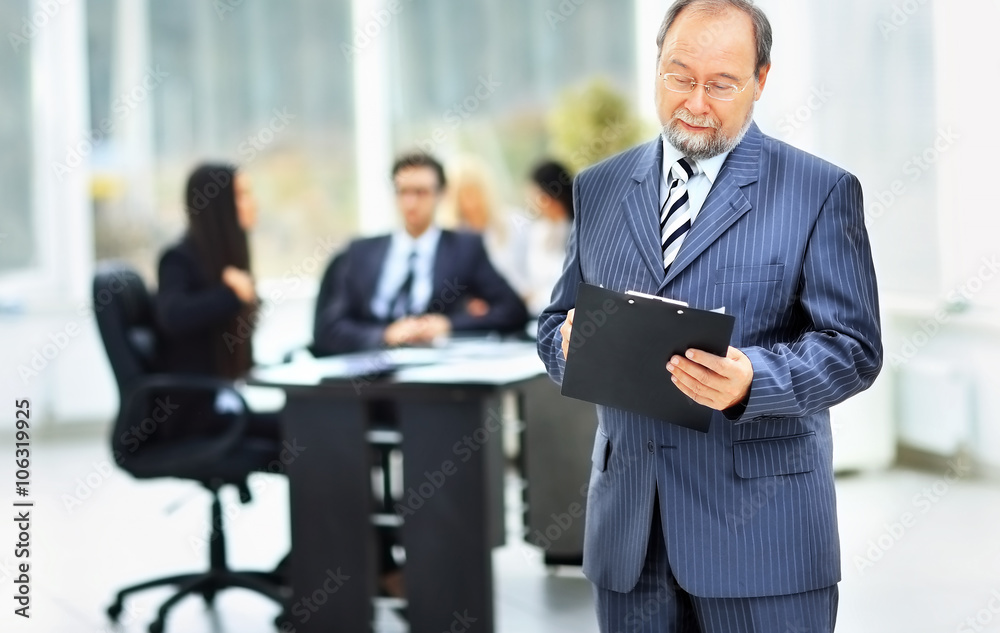 a successful businessman with documents a successful businessman with documents