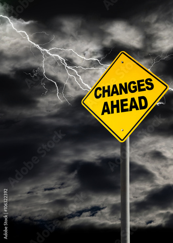 Changes Warning Sign Against Cloudy and Thunderous Sky