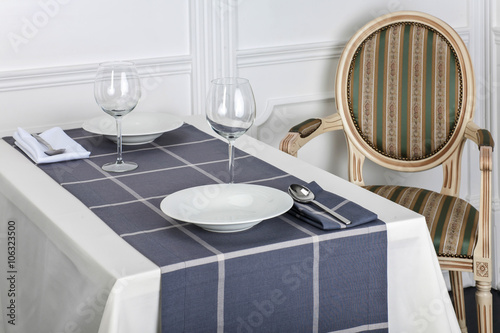 Beautiful decorated table with linen napkins, cutlery on luxurious tablecloth