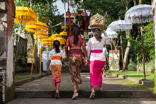 Women walks up the stairs during the celebration before Nyepi (Balinese Day of Silence). Ubud, Indonesia.