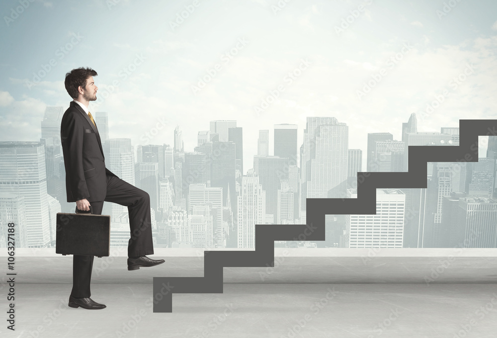 Business person in front of a staircase Business person in front of a staircase