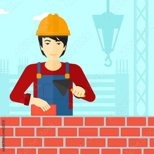 Bricklayer with spatula and brick.