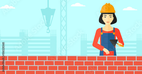 Bricklayer with spatula and brick.