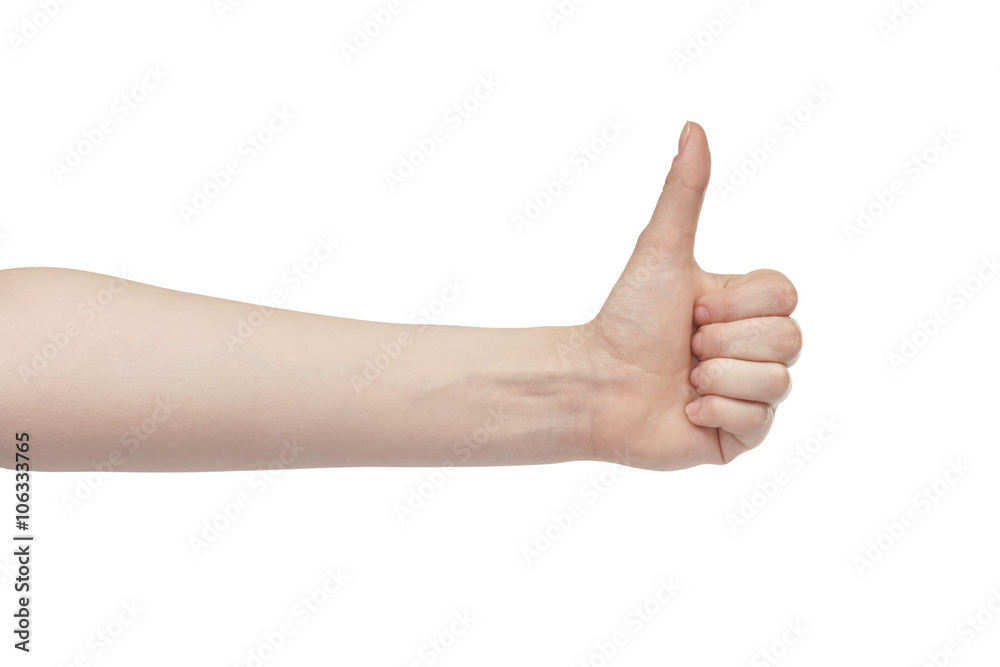 young woman left hand shows thumb up gesture, isolated on white young woman left hand shows thumb up gesture, isolated on white