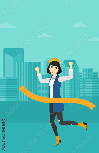 Business woman crossing finish line.