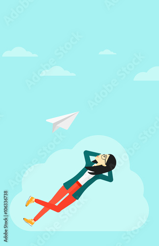 Business woman relaxing on cloud.