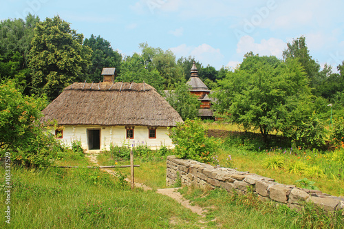 Old traditional house and church in Ukraine