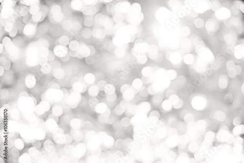 Artistic style - Defocused abstract white and gray bokeh lights background with blurring lights for your design