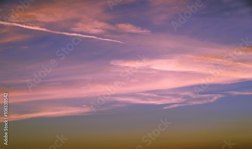 Sunset. Blue sky with pink layered and cirrus clouds over the Adriatic