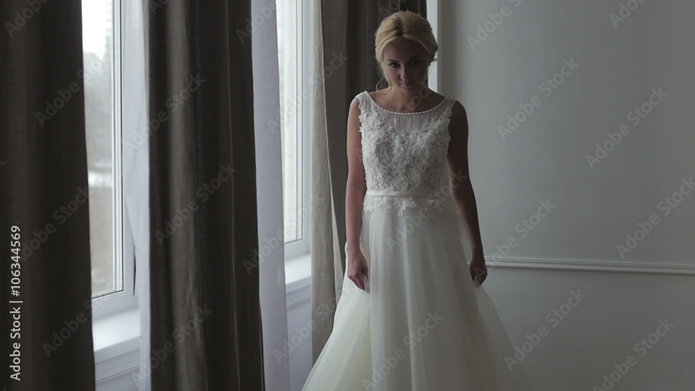 Beautiful bride posing in her wedding dress Beautiful bride posing in her wedding dress