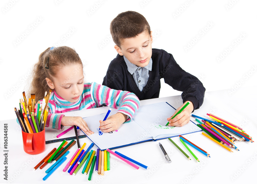 Happy funny kids draw. The boy and the girl draws pencils. Creativity concept. Happy funny kids draw. The boy and the girl draws pencils. Creativity concept.