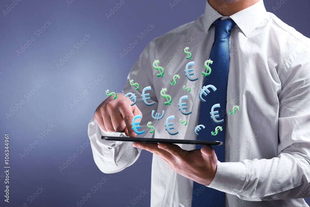 Making money online concept. Male hand touching screen tablet with dollar and euro bills coming out, close-up Making money online concept. Male hand touching screen tablet with dollar and euro bills coming out, close-up