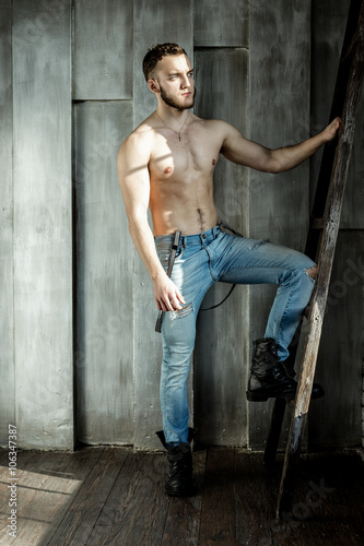 Attractive young Man posing wearing jeans © smmartynenko