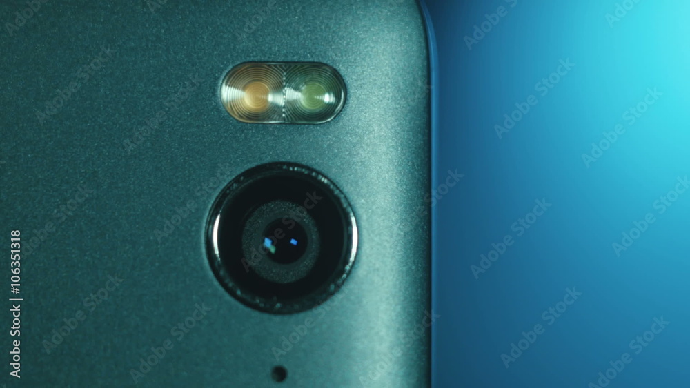 Closeup of Smartphone Camera Module on the back, placed on blue gradient background Closeup of Smartphone Camera Module on the back, placed on blue gradient background