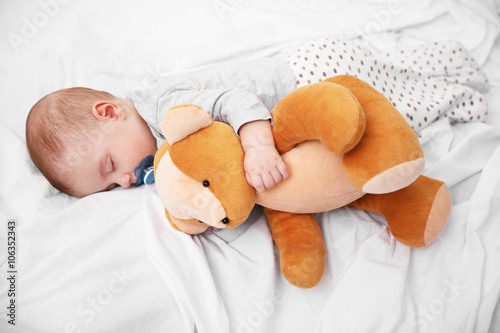 Loving baby with teddy bear...