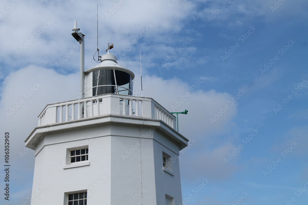 The Tower and Light of a Coastal Lighthouse.