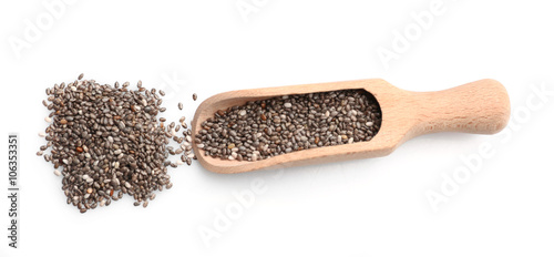 Chia seeds in scoop on white background