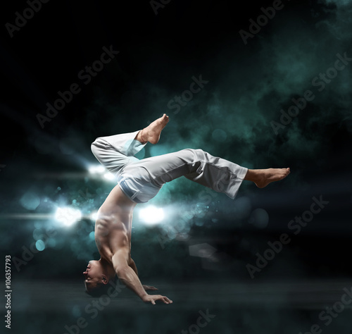 male fighter trains capoeira