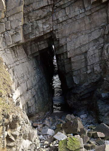 Sea cave, Collieston, Aberdeenshire, Scotland photo