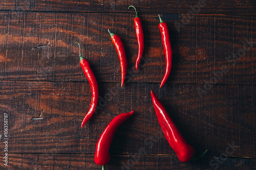 chili peppers on a wooden background