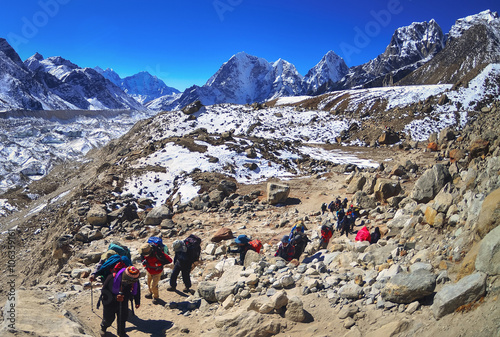 Trekking in Himalaya. Group of hikers with backpacks on the trek in Himalayas, trip to the base camp Everest 