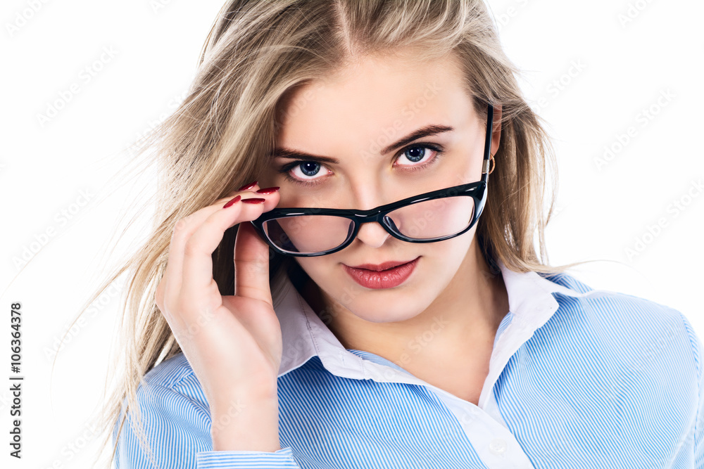 Portrait of a beautiful girl in glasses. - This is a photo of a cute young girl with glasses at the camera in shirt. Isolated white background. Portrait of a beautiful girl in glasses. - This is a photo of a cute young girl with glasses at the camera in shirt. Isolated white background.