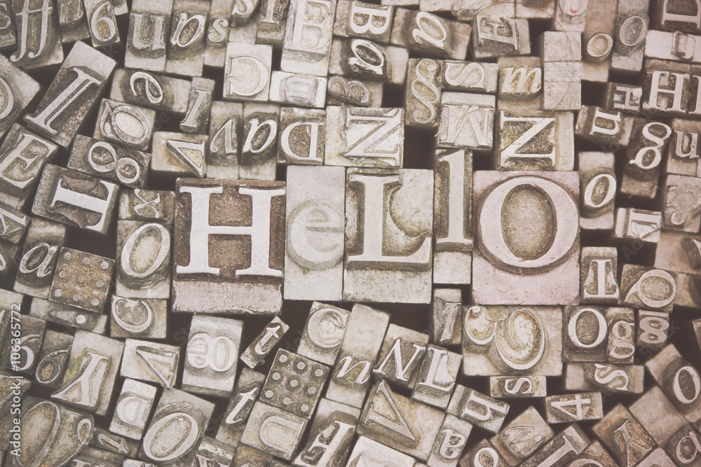 Obraz premium Close up of typeset letters with the word Hello