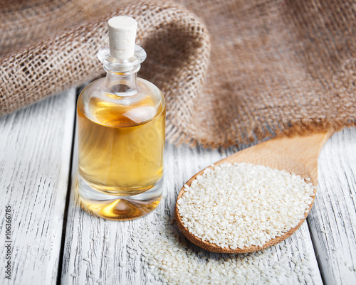 Sesame seeds and bottle with oil