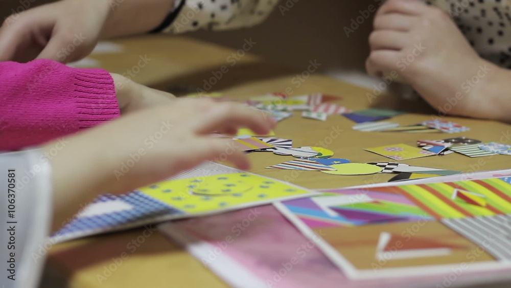 psychologist occupation in kindergarten with two girls, are testing the game