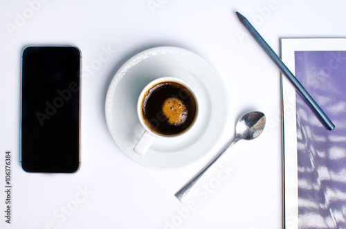 workplace on top with coffee and phone log